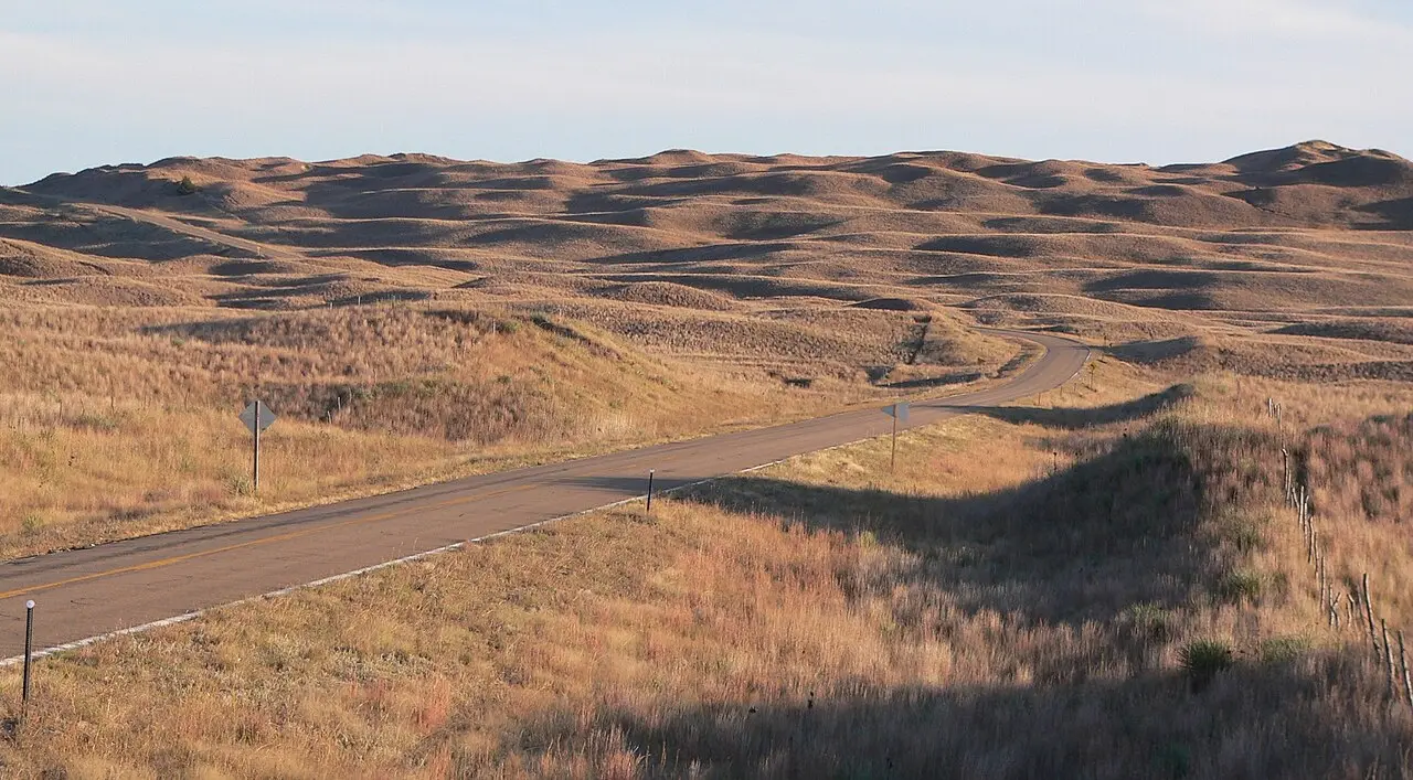 Rolling grass-covered dunes of the Nebraska Sandhills under a wide sky