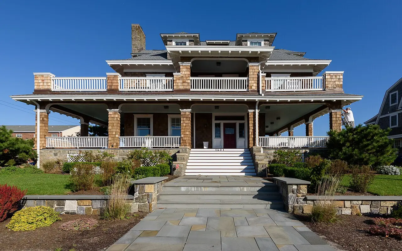A painted Victorian house with a wraparound porch in the Cape May historic district