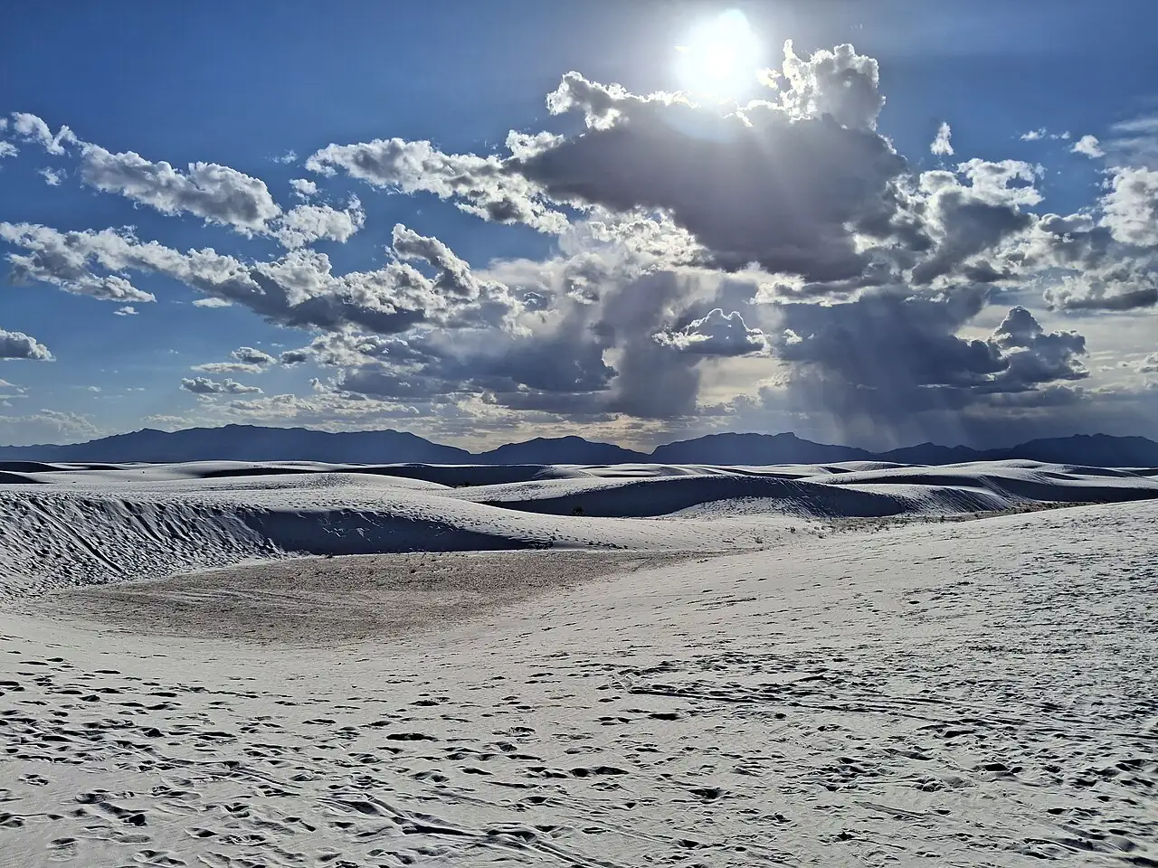 Dunes, clouds and sun at White Sands National Park