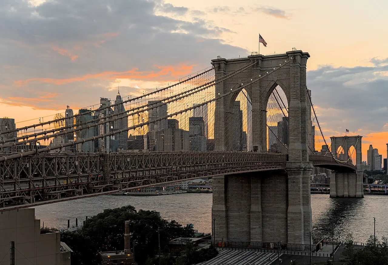 The Brooklyn Bridge spanning the East River with the Lower Manhattan skyline behind