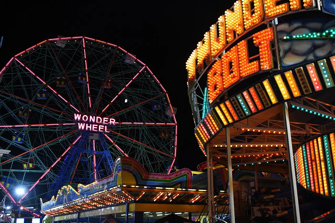The illuminated Wonder Wheel and Thunderbolt rollercoaster at Coney Island at night