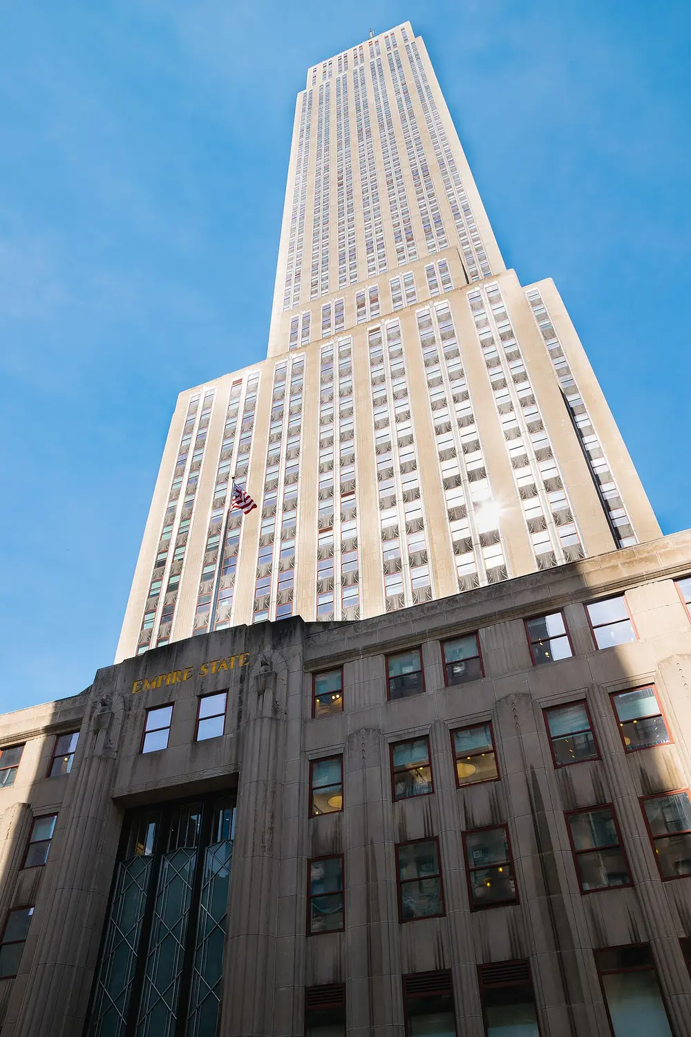 The Empire State Building rising above Midtown Manhattan on a clear day