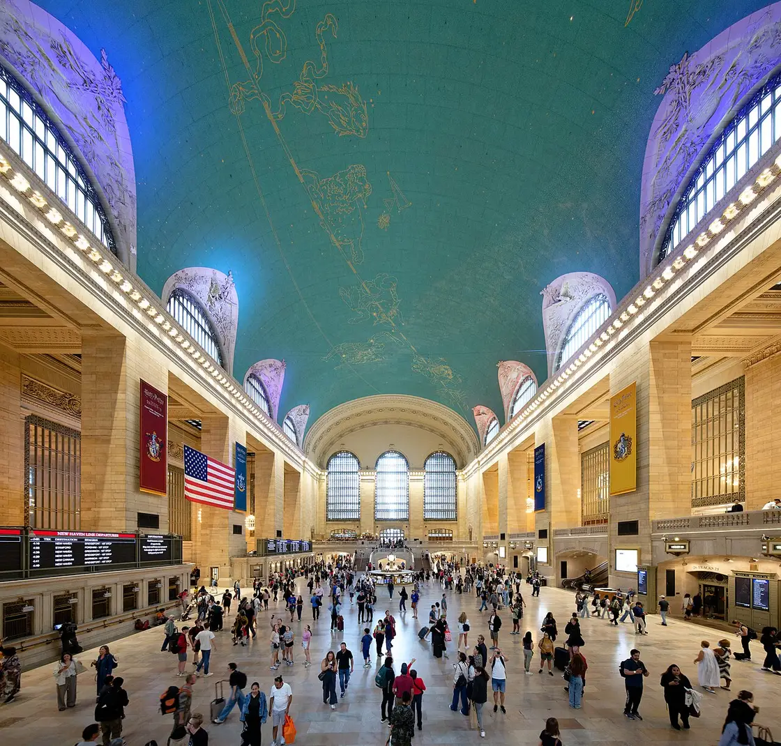 The main concourse of Grand Central Terminal with its painted celestial ceiling and tall arched windows