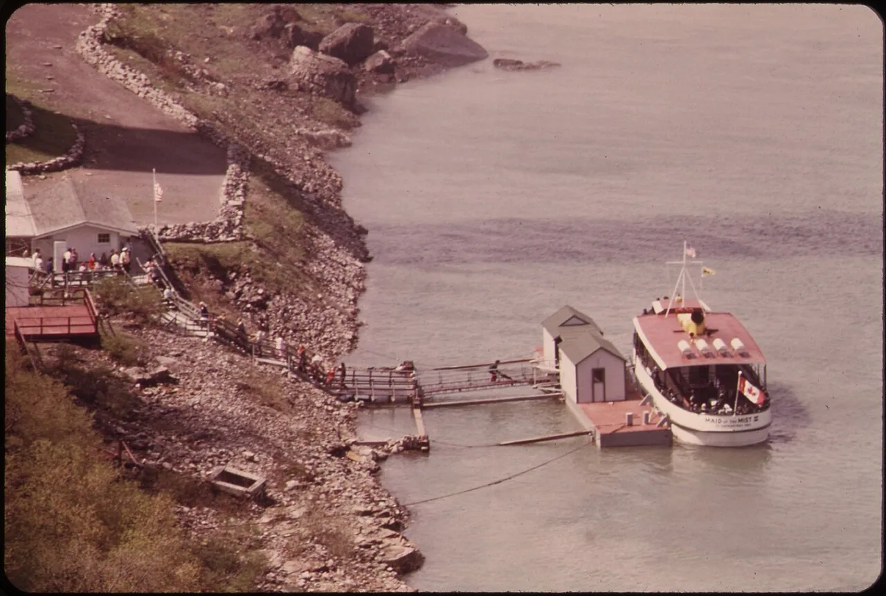 A Maid of the Mist sightseeing boat at the dock on the Niagara River below the falls