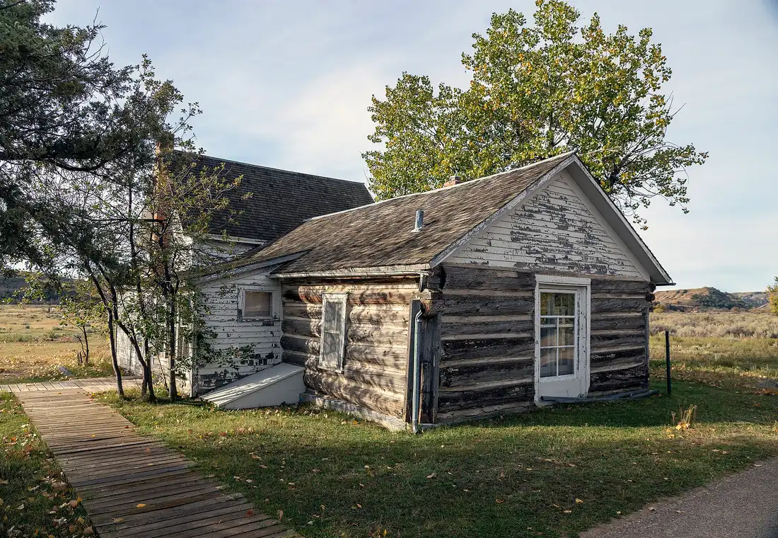 Peaceful Valley Ranch buildings against badlands hills in the South Unit