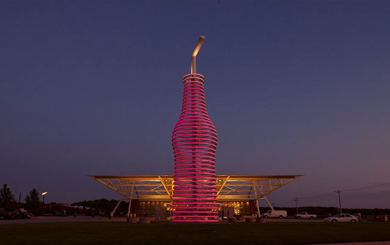 The 66-foot neon soda bottle sign at Pops in Arcadia lit up at dusk