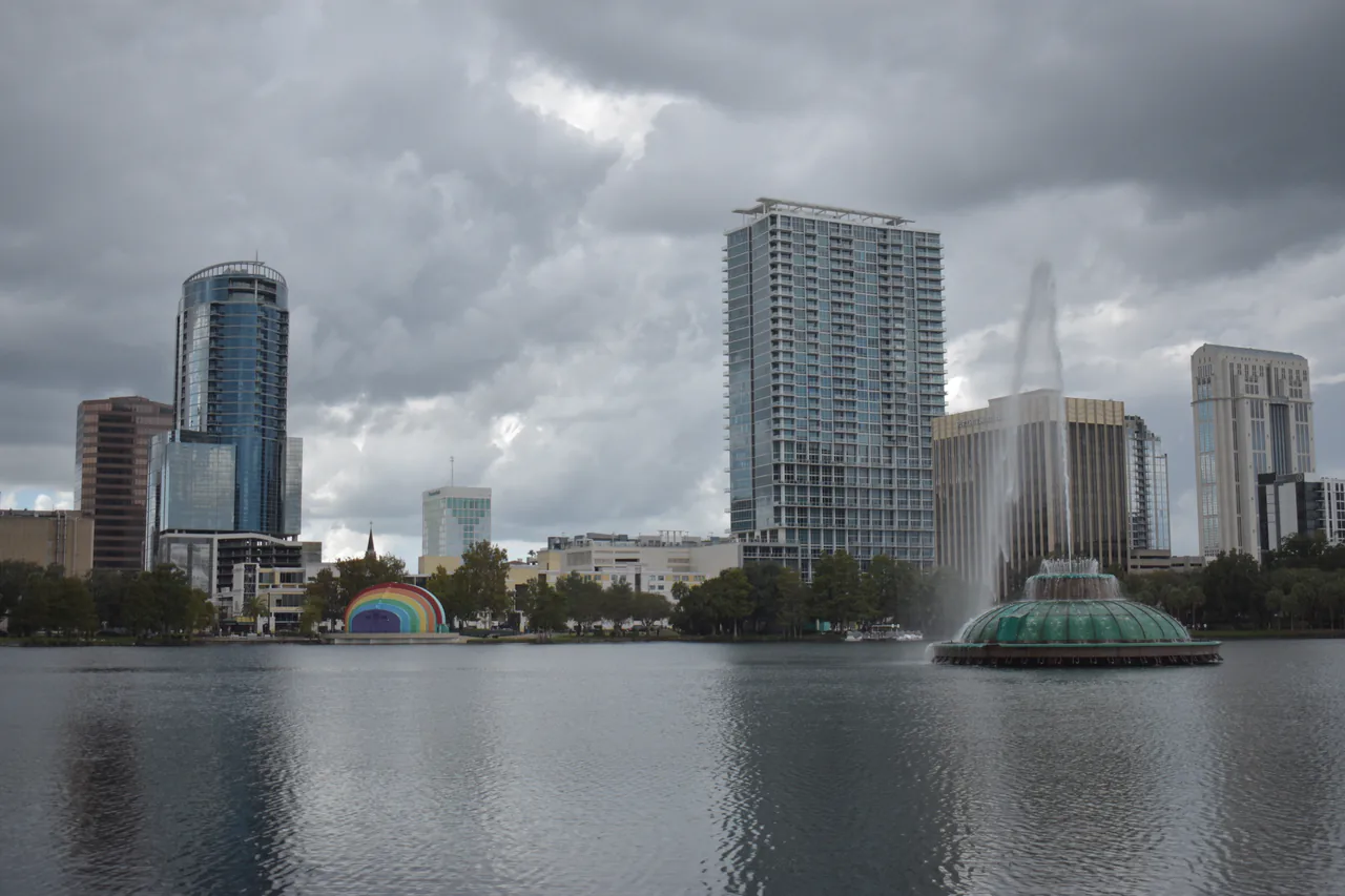 The fountain on Lake Eola with the downtown Orlando skyline behind it