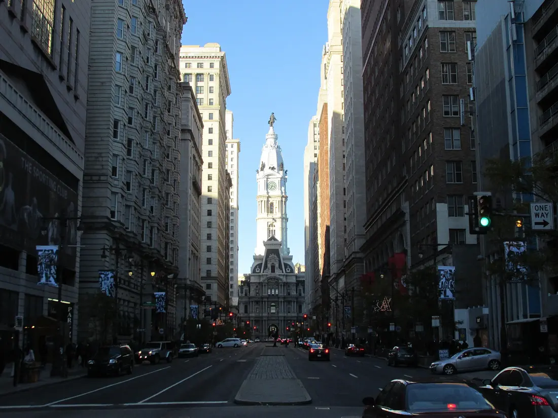 The tower and ornate stone facade of Philadelphia City Hall at Broad and Market Streets