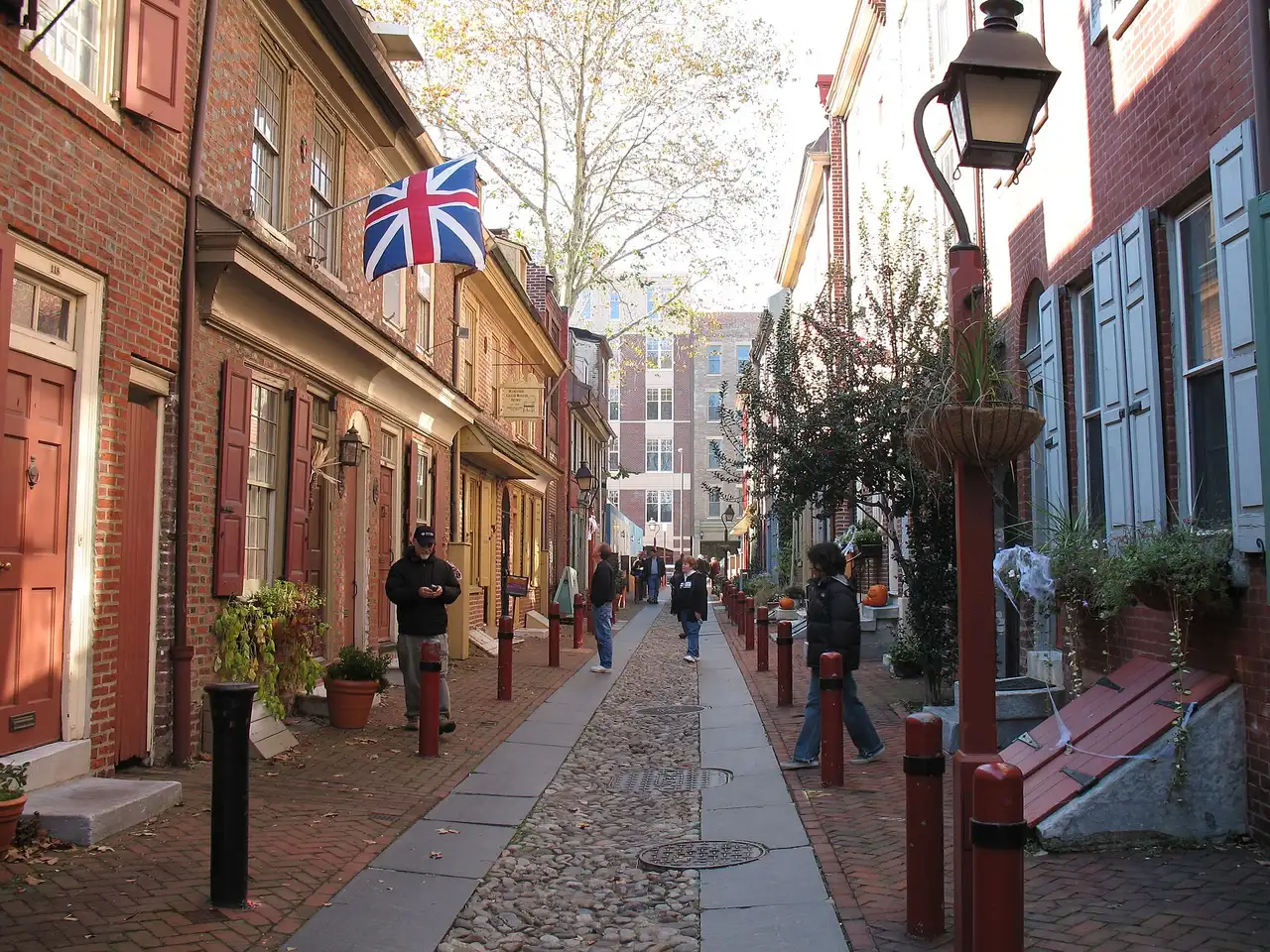 The narrow cobbled lane of Elfreth's Alley lined with brick row houses in Old City Philadelphia
