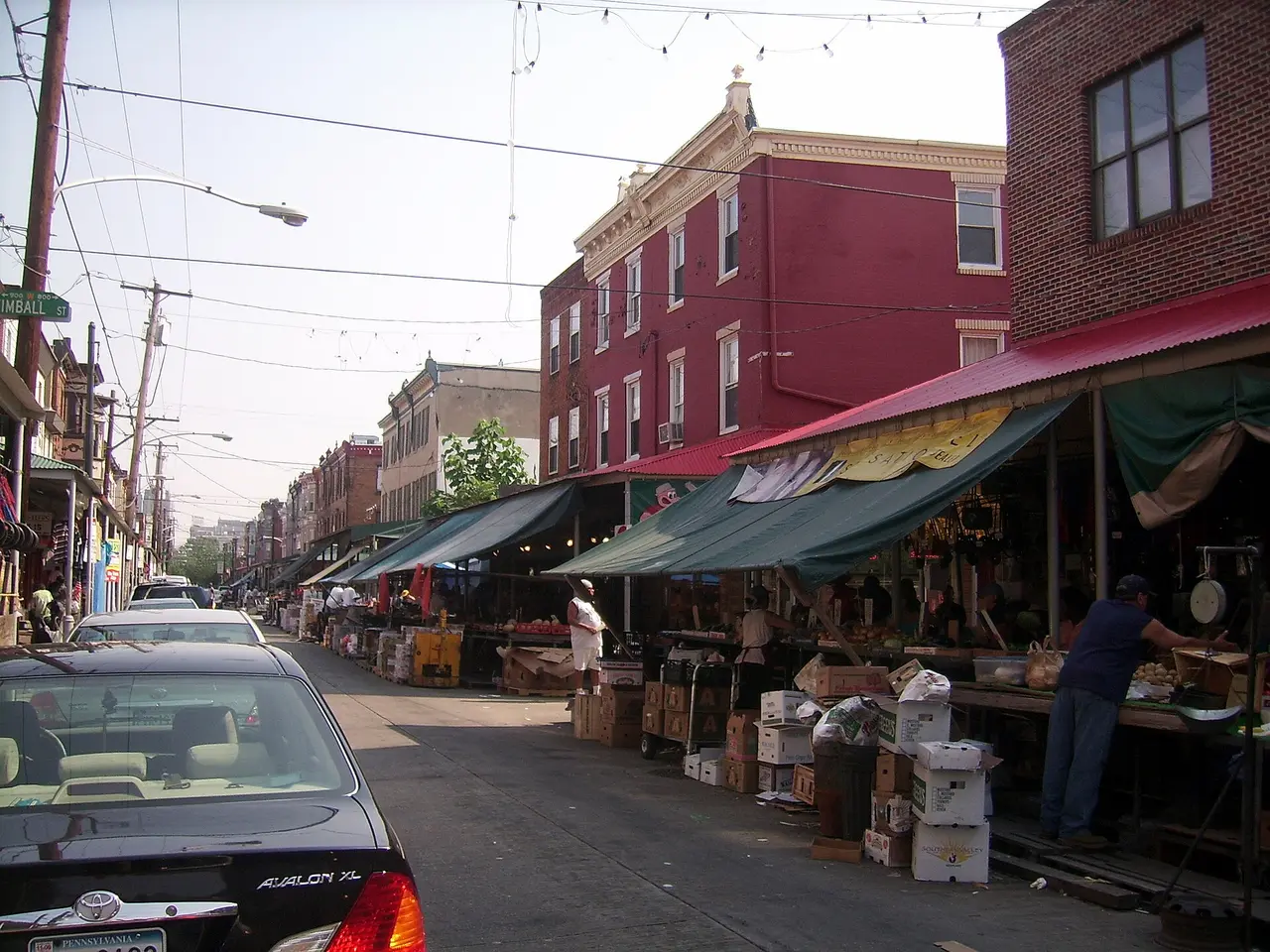 Awnings, produce stalls and shoppers along the 9th Street Italian Market in South Philadelphia