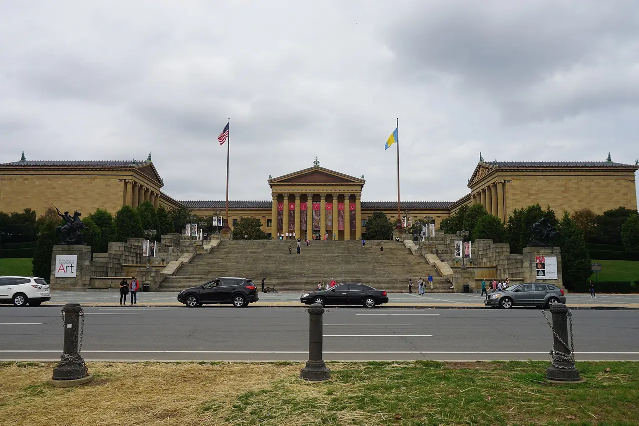 The columned east facade and steps of the Philadelphia Museum of Art at the end of the Benjamin Franklin Parkway