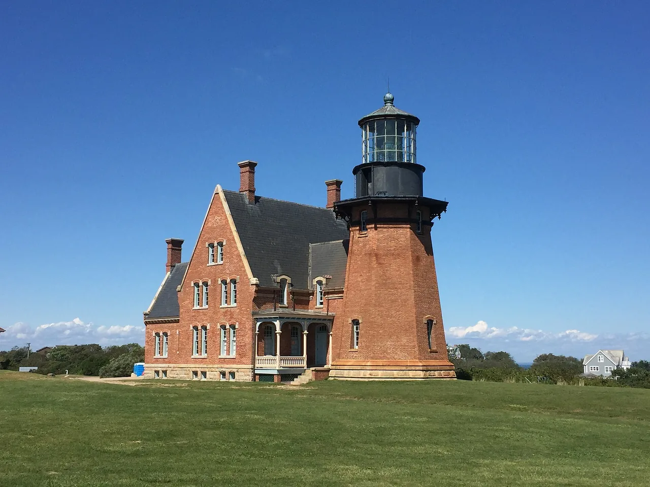 Southeast Lighthouse on Block Island above grassy bluffs