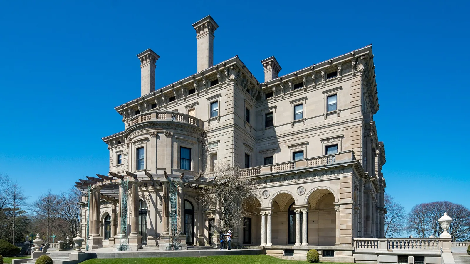 The ocean facade of The Breakers mansion rising above the lawn in Newport, Rhode Island