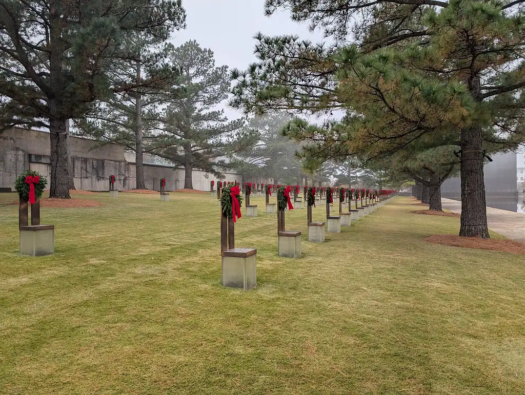 Rows of empty bronze and glass chairs in fog at the Oklahoma City National Memorial