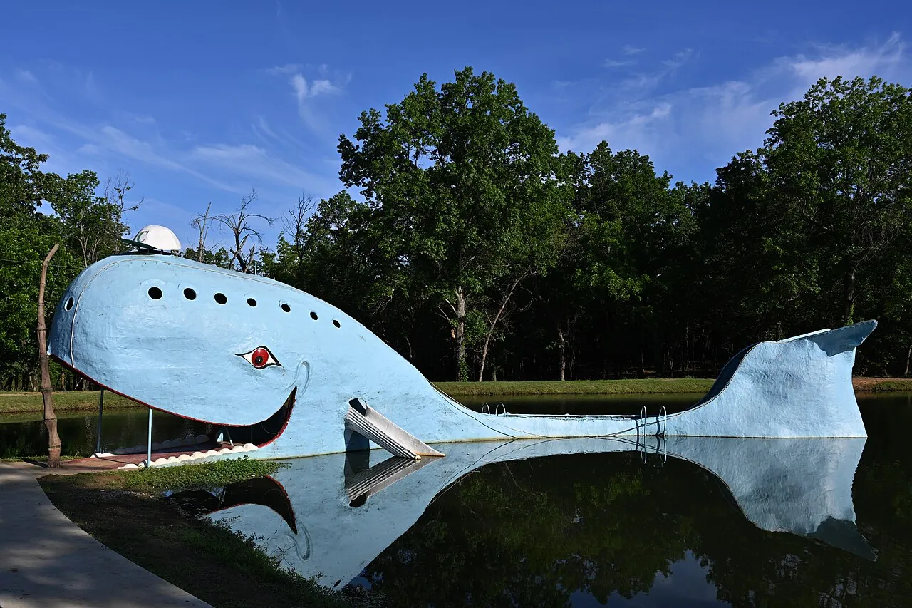 The Blue Whale of Catoosa roadside attraction reflected in its pond near Tulsa