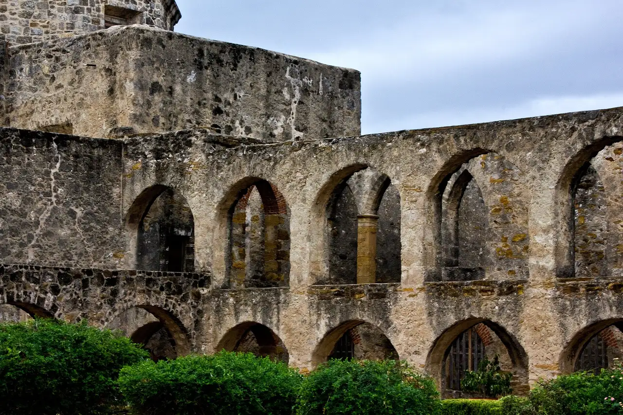 Arched stone arcade of the convento at Mission San Jose in San Antonio
