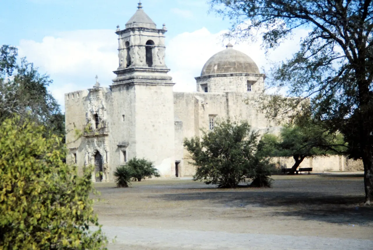 The stone church and bell tower of Mission San Jose in San Antonio
