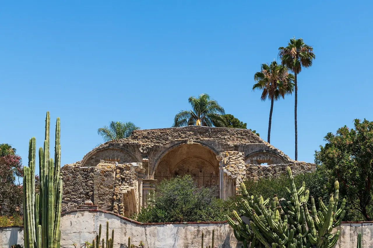 The stone church and bell wall of Mission San Juan Capistrano in San Antonio