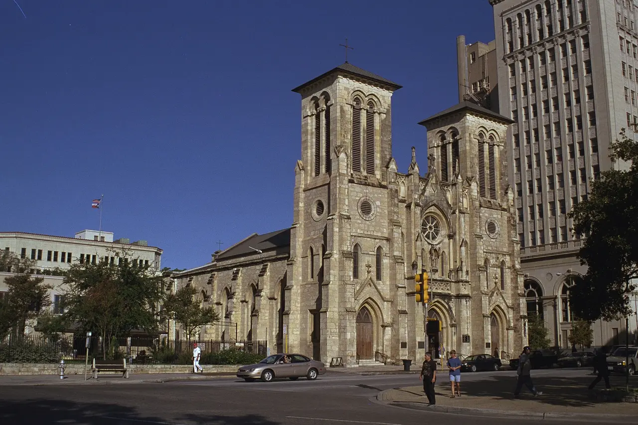 The stone facade and twin towers of San Fernando Cathedral on Main Plaza in San Antonio