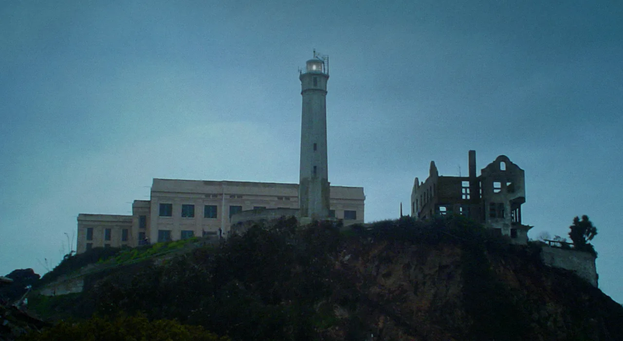 The Alcatraz cellhouse, lighthouse and ruined warden's house on the island in San Francisco Bay
