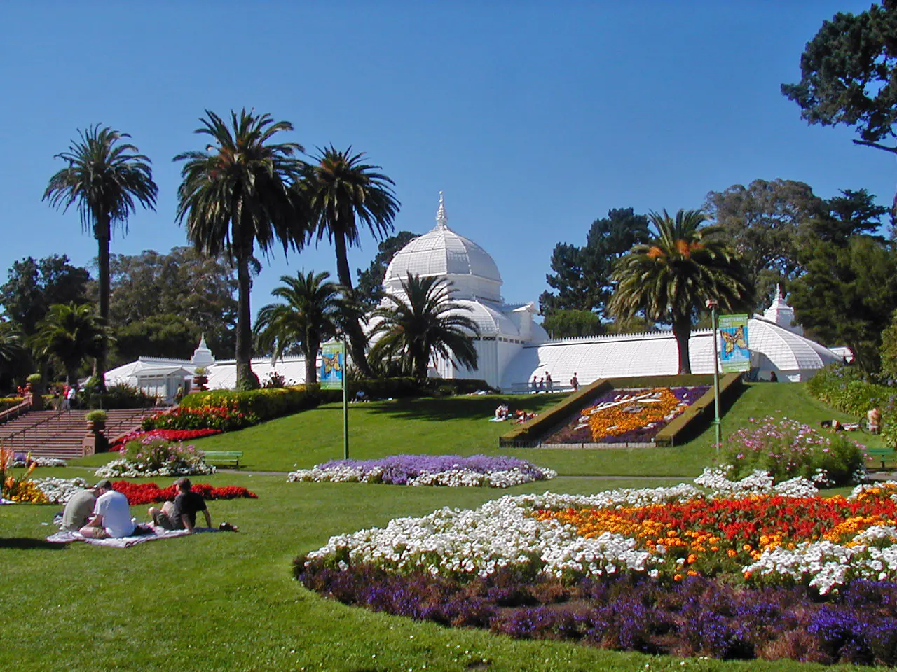 The white Victorian glasshouse of the Conservatory of Flowers in Golden Gate Park