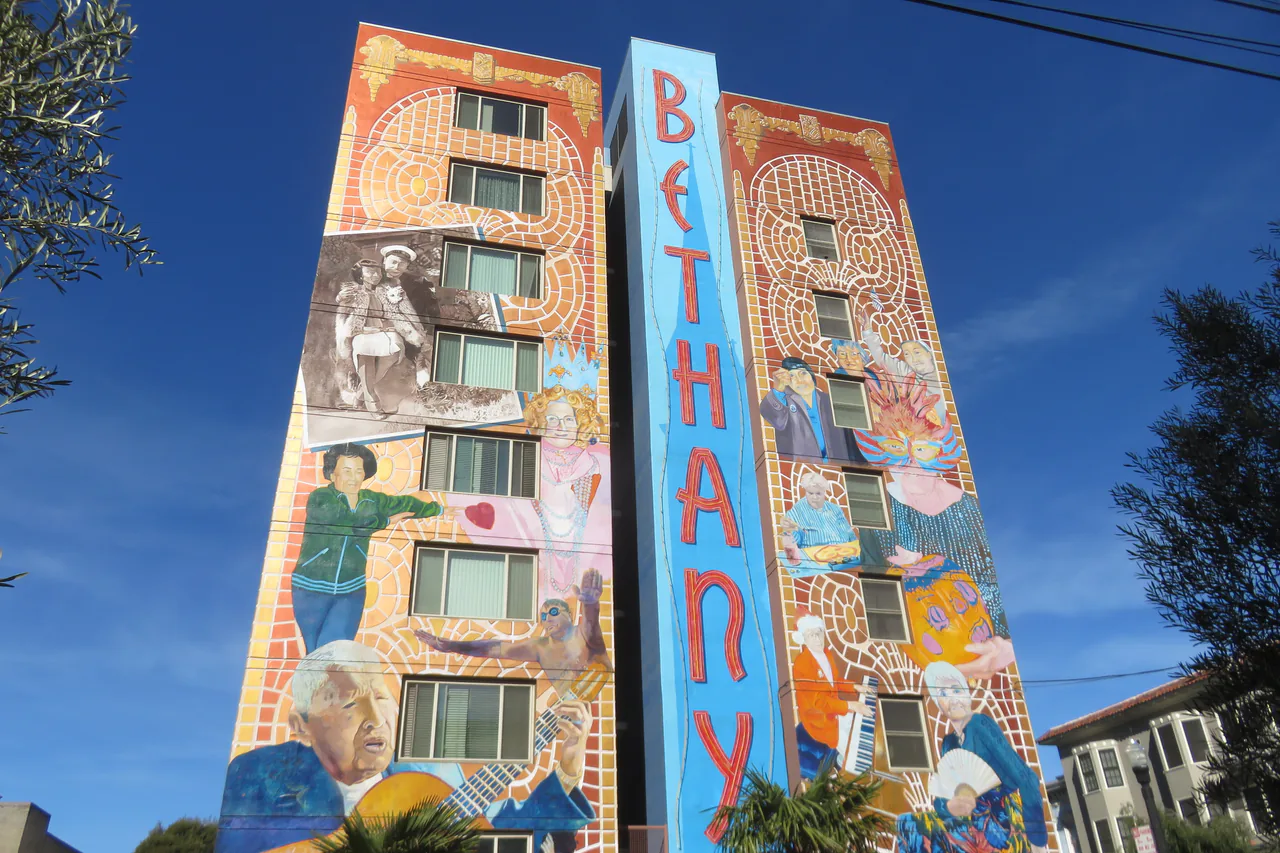 A large painted mural covering a wall in the Mission District of San Francisco