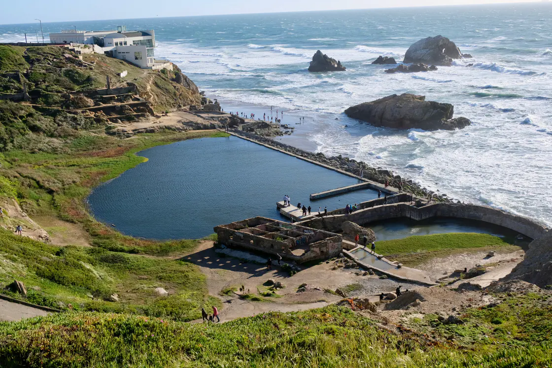 The concrete ruins of the Sutro Baths on the shore at Lands End in San Francisco