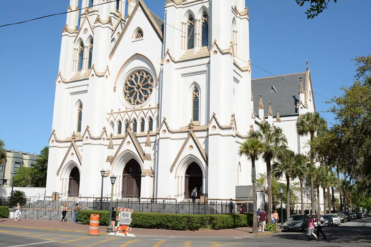 Twin spires of the Cathedral Basilica of St. John the Baptist above Savannah rooftops
