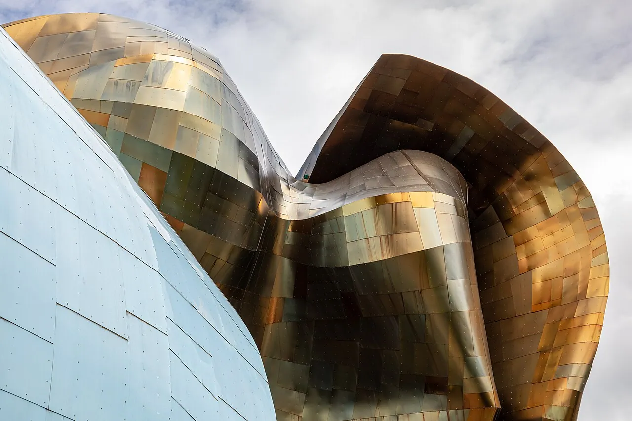 The curved multicolored metal facade of the Museum of Pop Culture at Seattle Center