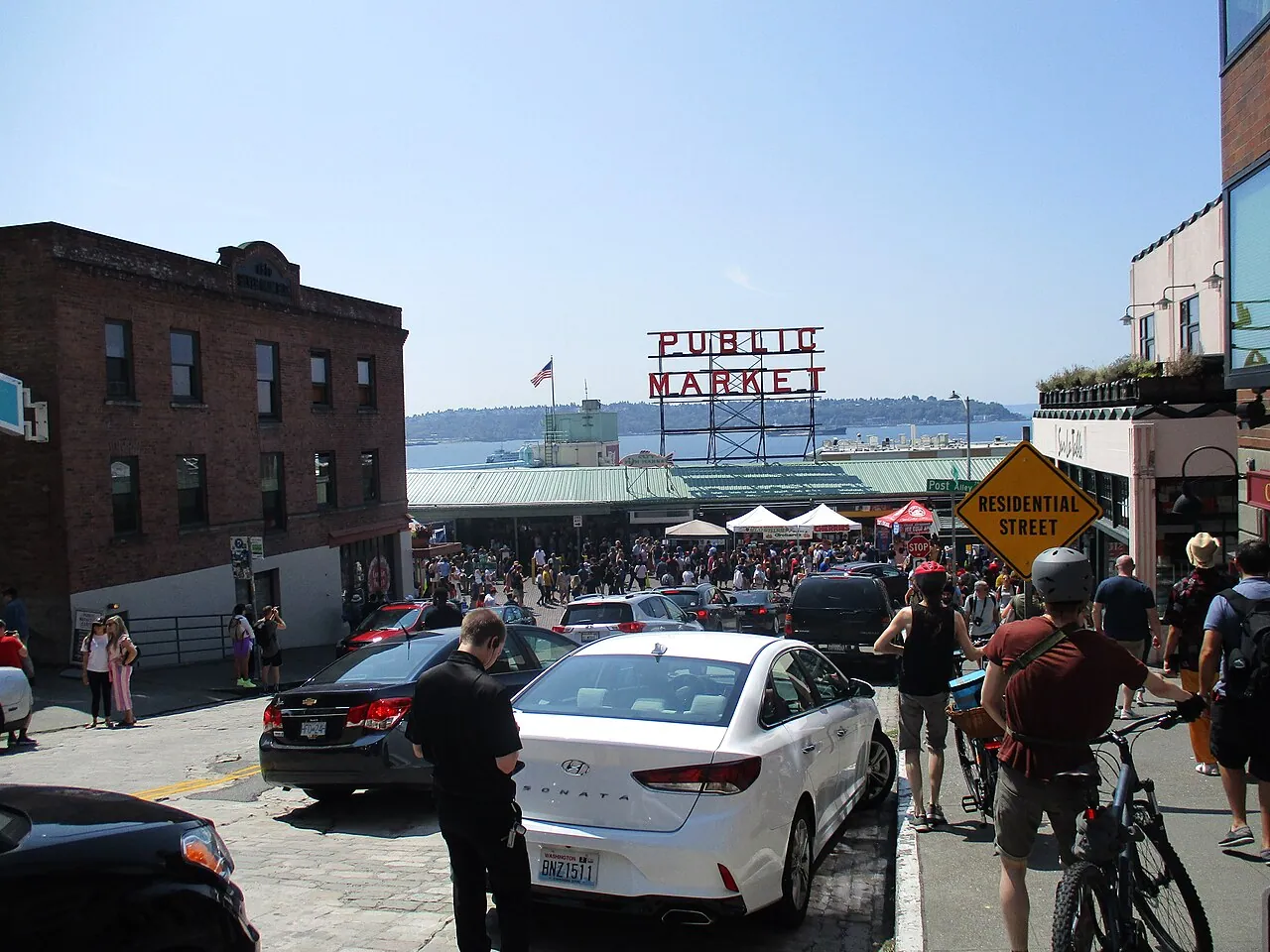 The Pine Street entrance to Pike Place Market with its neon Public Market Center sign