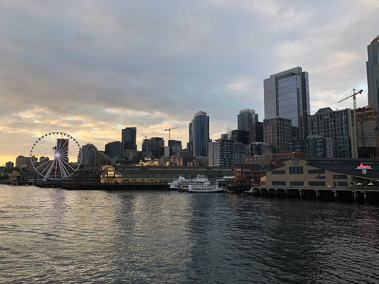 The Seattle waterfront with the Great Wheel and downtown towers behind