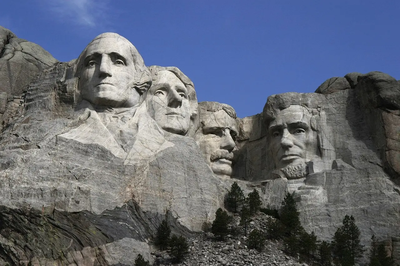 The carved faces of Mount Rushmore National Memorial under a clear Black Hills sky