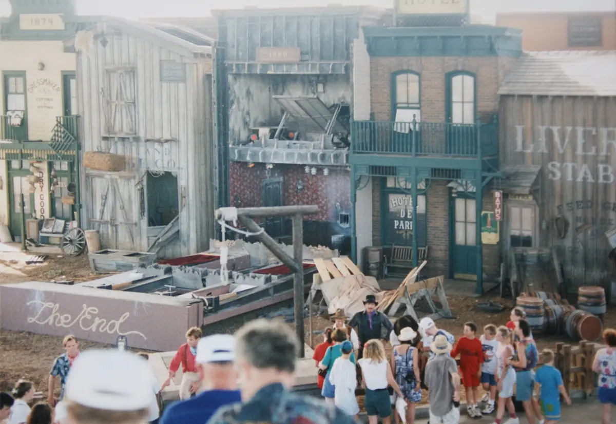 Palm trees and studio-lot facades along a street inside Universal Studios Florida