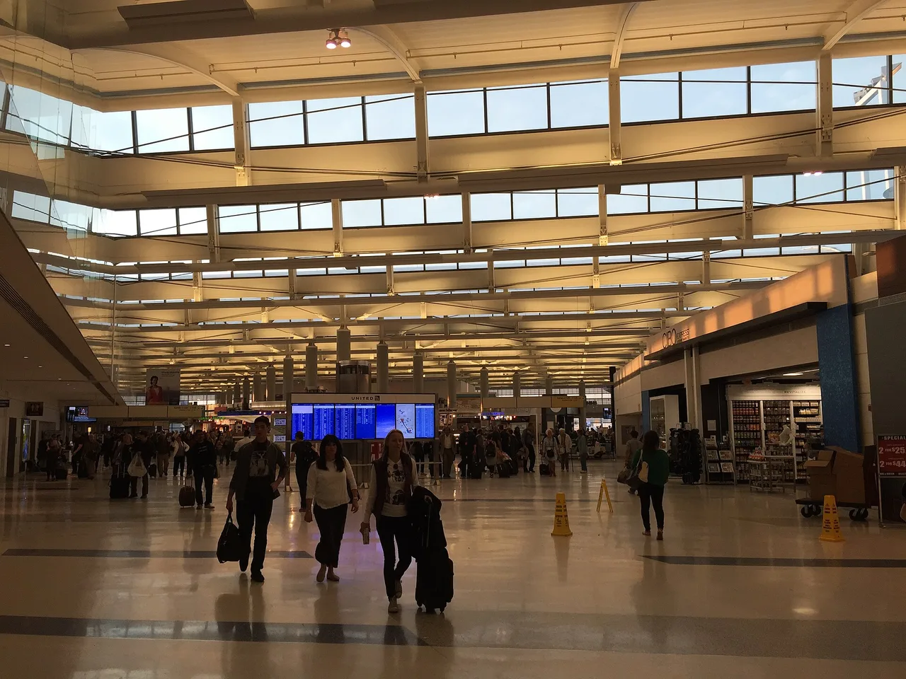 Passengers waiting at a gate concourse inside Terminal C at Newark Liberty International Airport