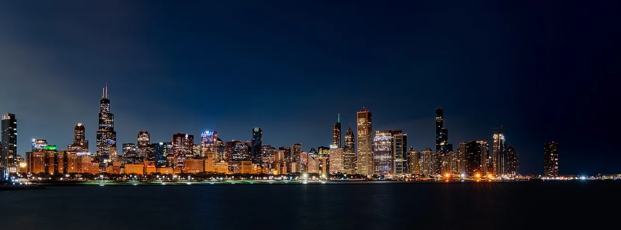 The Chicago skyline at sunrise seen across Lake Michigan