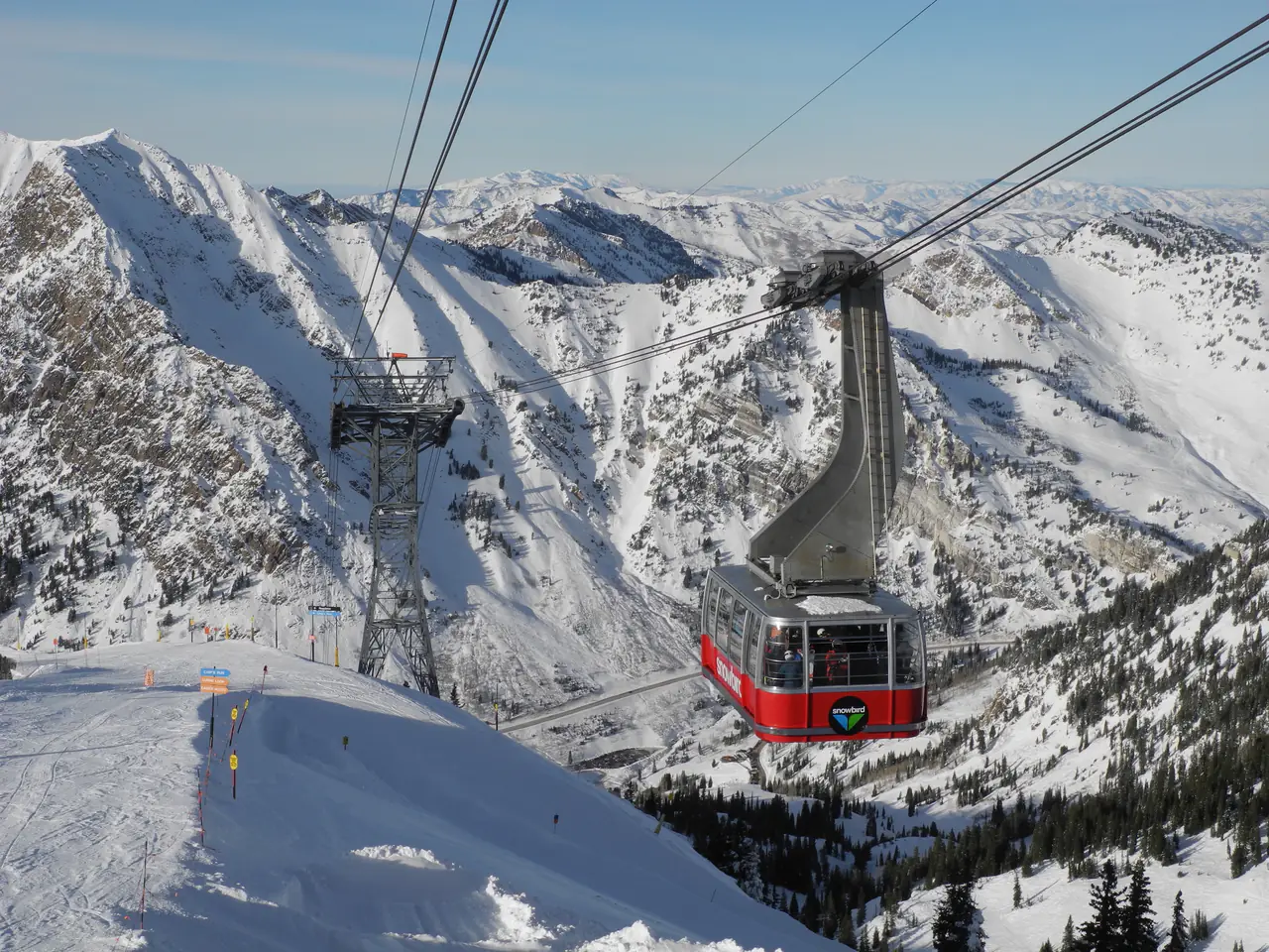 The Snowbird aerial tram car arriving at Hidden Peak above Little Cottonwood Canyon, Utah