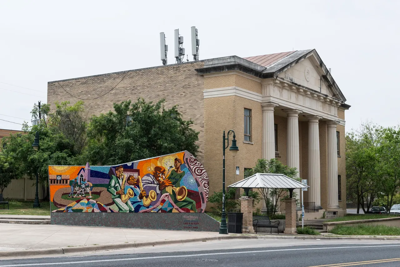 Colorful mosaic mural of Austin musicians in Dr. Charles E. Urdy Plaza, East Austin
