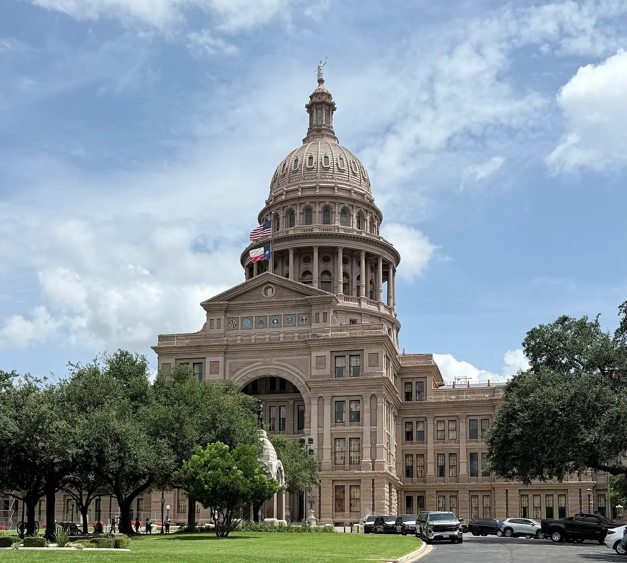 The pink granite Texas State Capitol building in downtown Austin