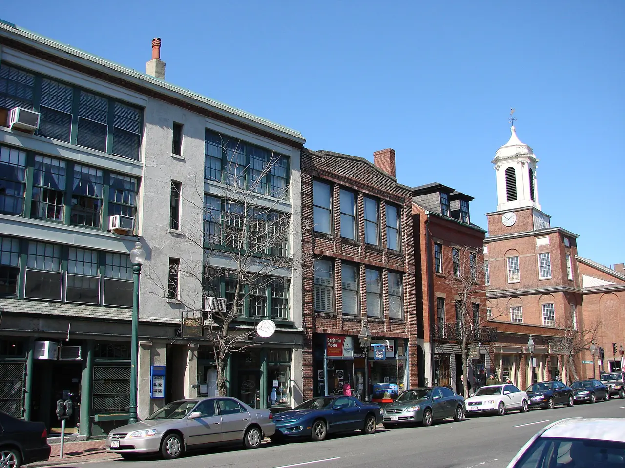 Storefronts along Charles Street in Beacon Hill with the Charles Street Meeting House at the end