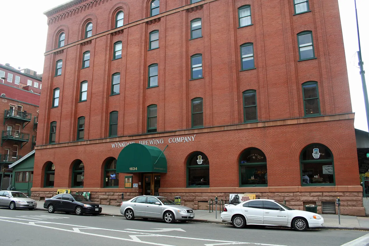 The red-brick Wynkoop Brewing Company building on Wynkoop Street with arched ground-floor windows