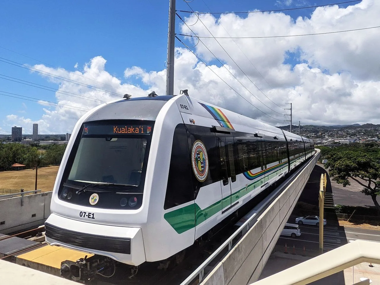A Skyline light metro train at an elevated station in Honolulu