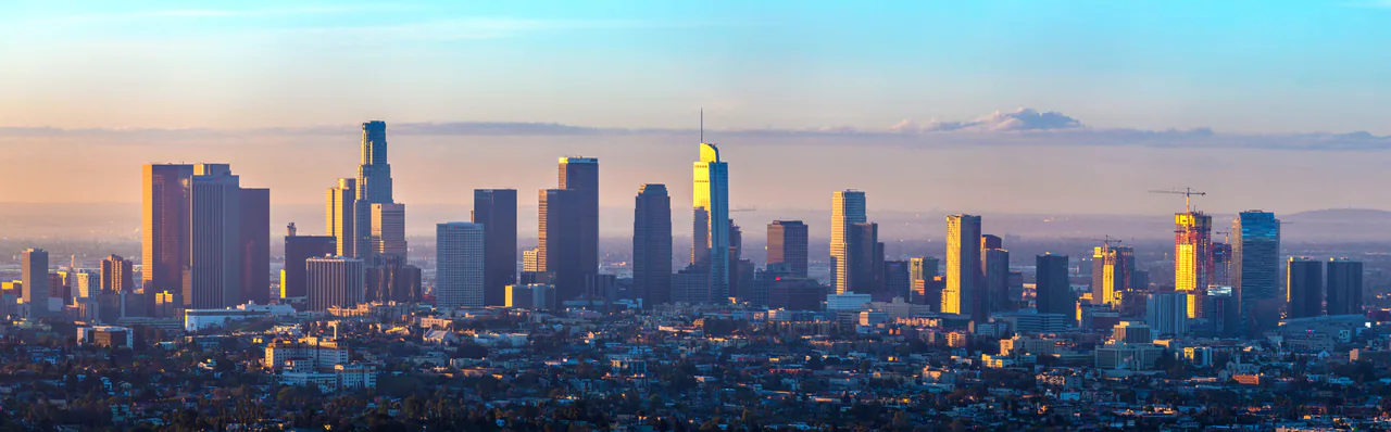 Downtown Los Angeles skyline at sunrise seen as a wide panorama