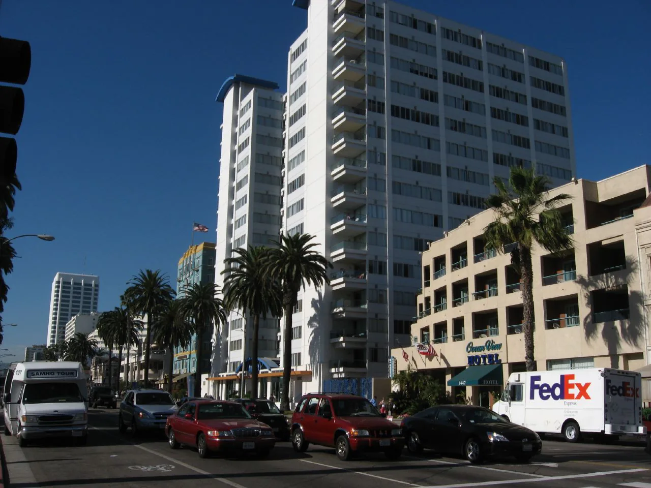 Hotels and palm trees along Ocean Avenue in Santa Monica above the beach