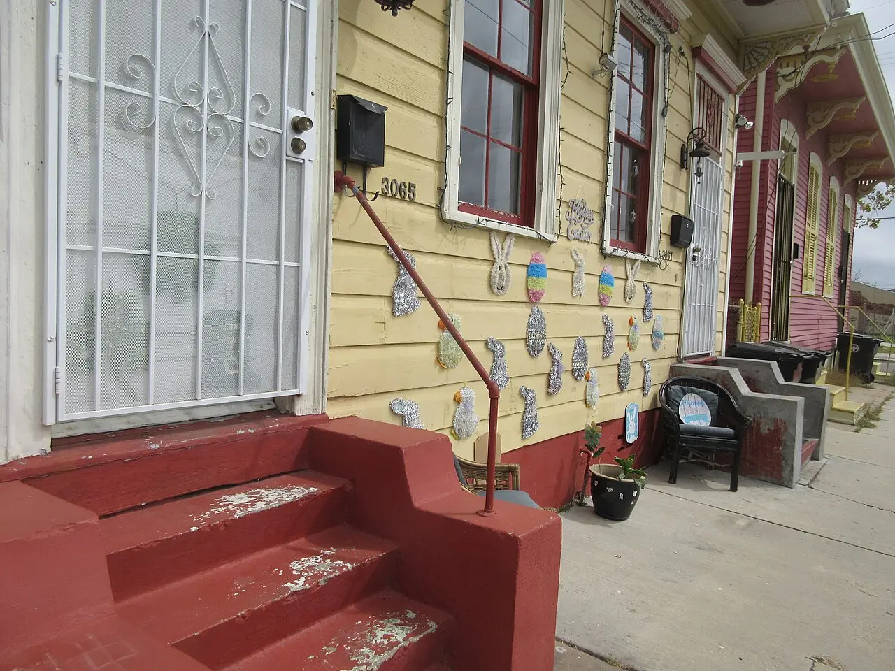 Painted shotgun houses on a residential street in the Bywater neighborhood of New Orleans