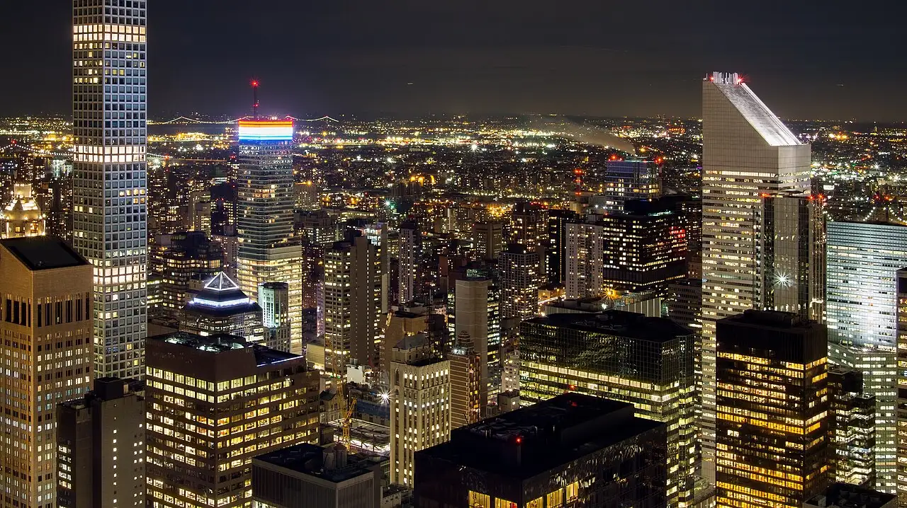Midtown Manhattan lit up at night looking north from Rockefeller Center