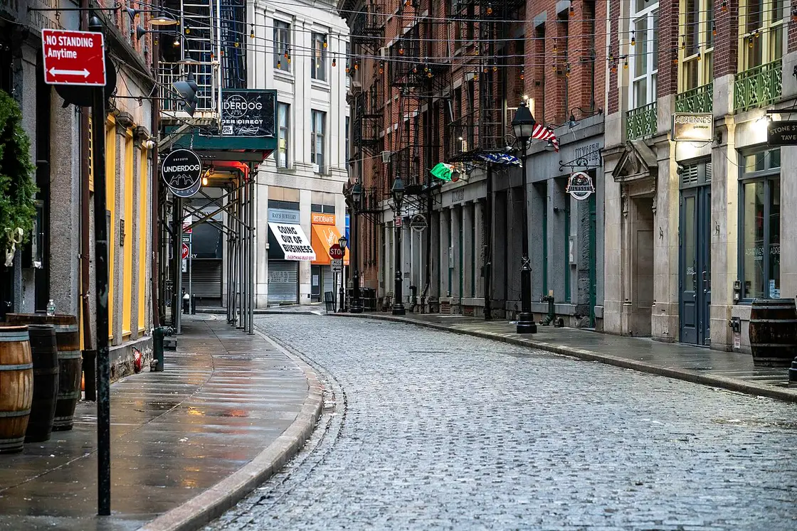 The cobblestoned Stone Street in the Financial District lined with bars and restaurants, empty early in the day