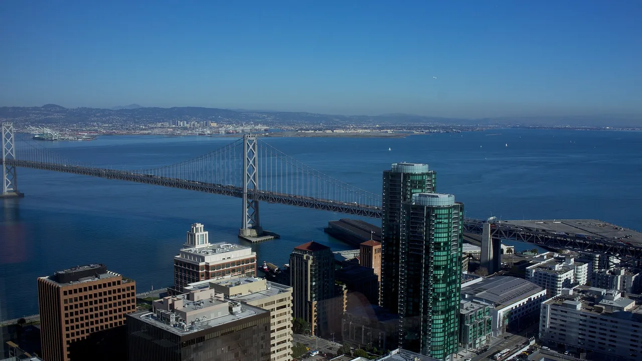San Francisco skyline with the Bay Bridge and downtown towers at dusk