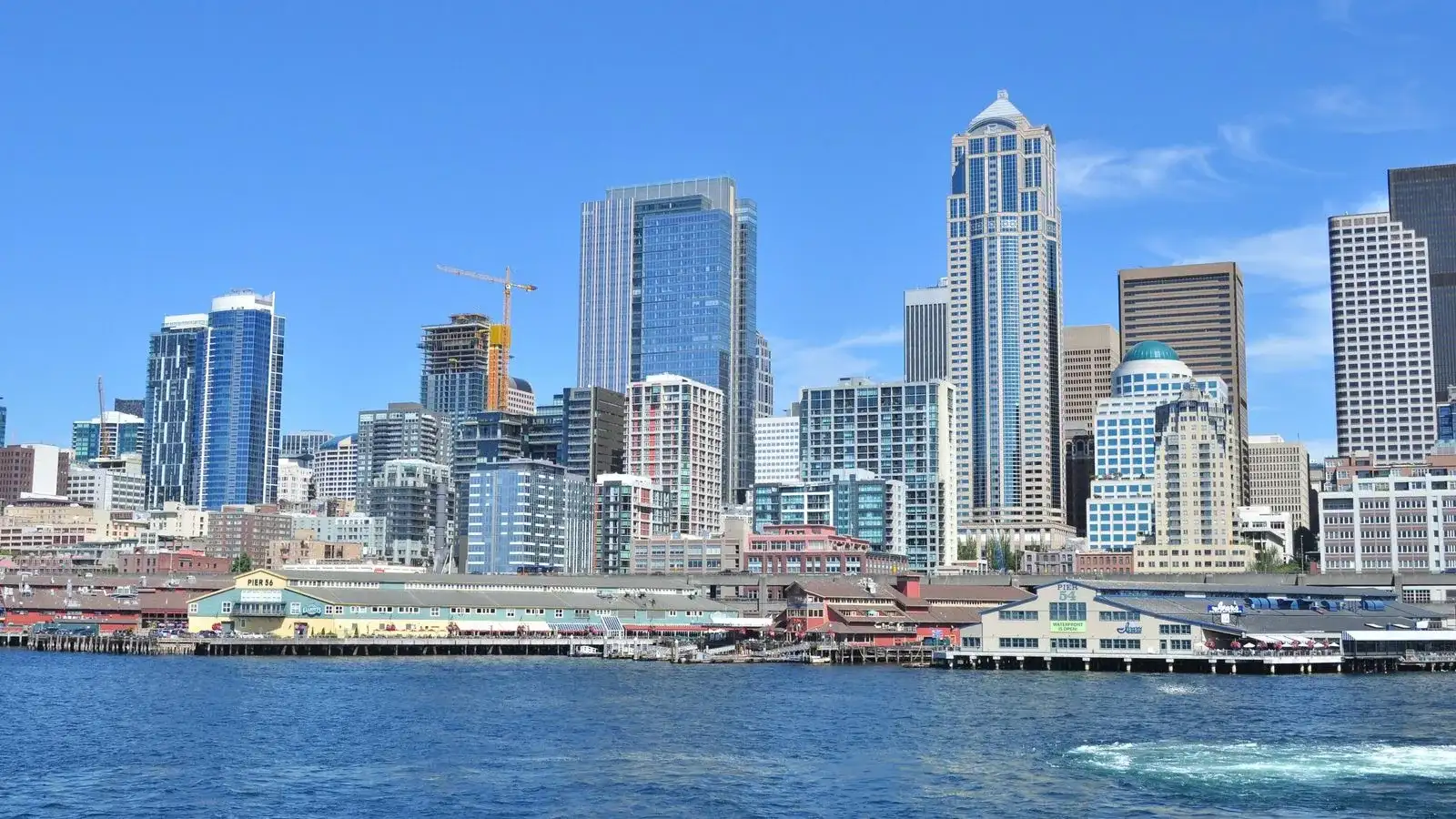 Downtown Seattle skyline and the waterfront piers seen from Elliott Bay on a clear day
