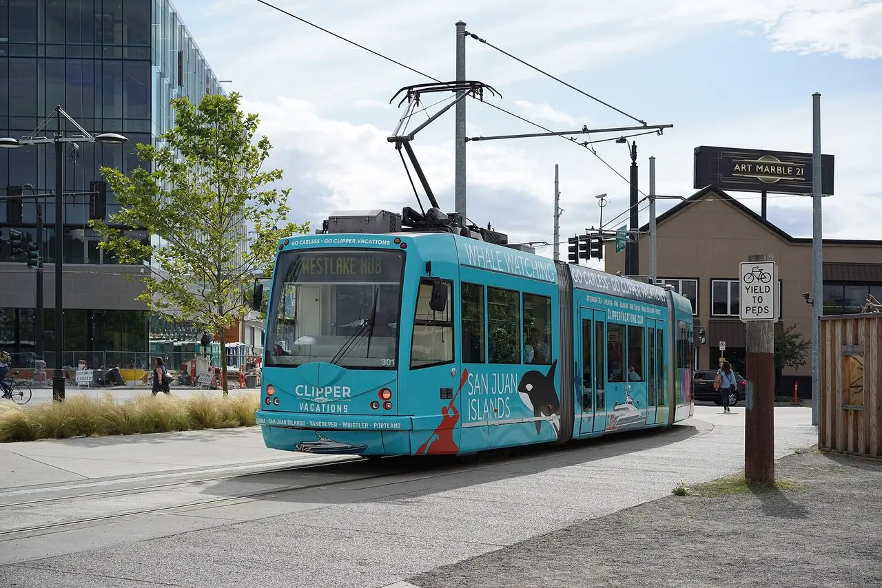 A South Lake Union streetcar on the tracks in Seattle with office buildings behind it