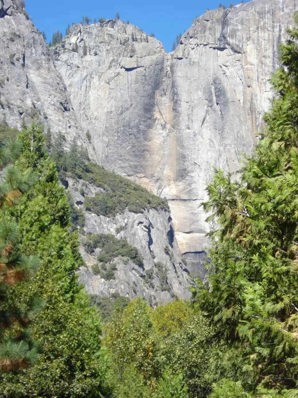 The bare granite cliff where Yosemite Falls flows, completely dry in late summer